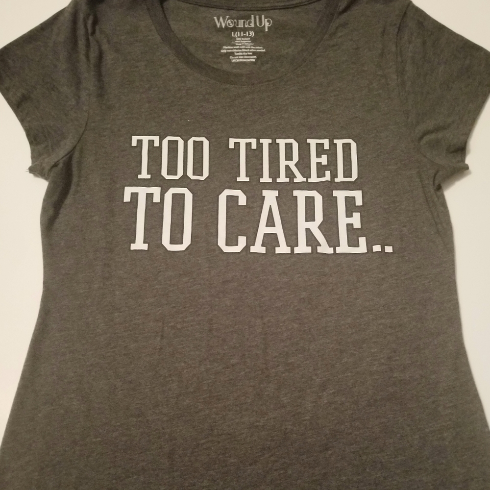 We are selling a grey shirt with white writing.